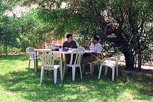 [ Wendy and Gabi talking in the garden ]